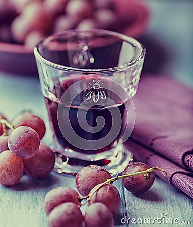 Glass of red wine and fresh grapes