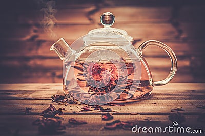 Glass teapot with blooming tea flower