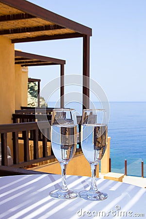 Glasses of champagne on balcony with sea view