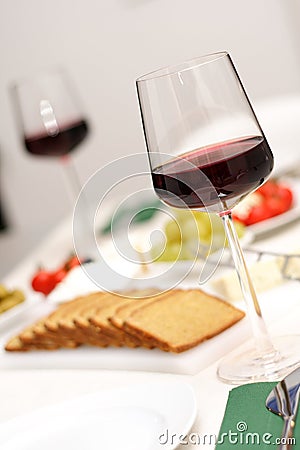 Glasses of red wine with appetiser