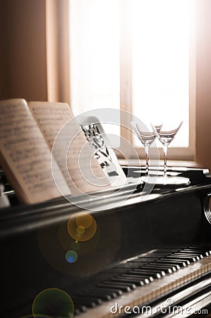 Glasses of wine and piano music