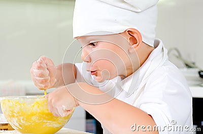 Gleeful young chef baking in the kitchen