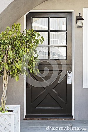 Glossy black door of a family home