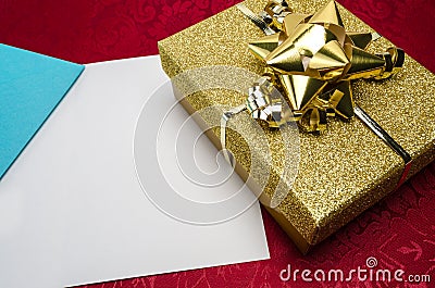 A Gold Box with Bow and Card
