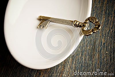 Gold Key in Dish