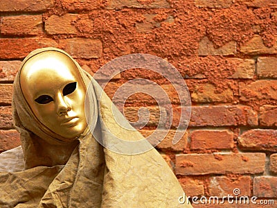 Gold mask and red wall