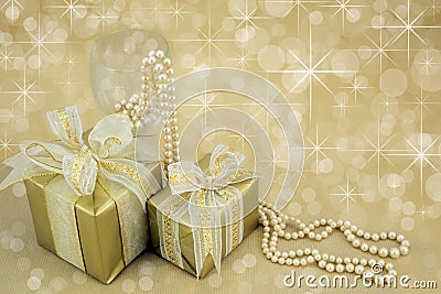 Gold wrapped presents with pearls