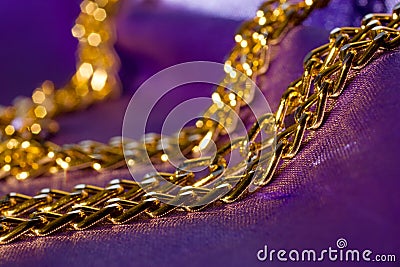 Golden chain on shiny silk