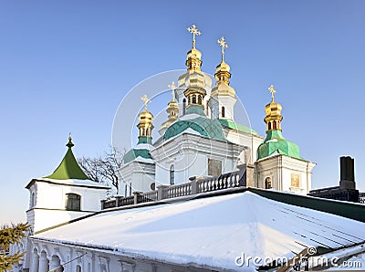 Golden domes in snow at Kiev Pechersk Lavra