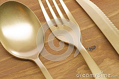 Golden spoon, fork and knife