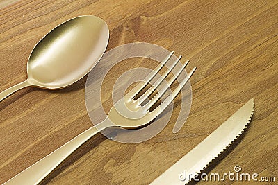Golden spoon, fork and knife