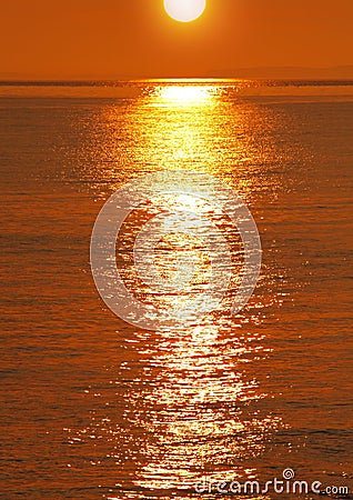 Golden sunset over water