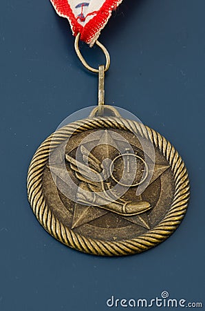 Golden track and field medal