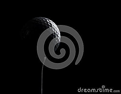 Golf ball on black background with copy space