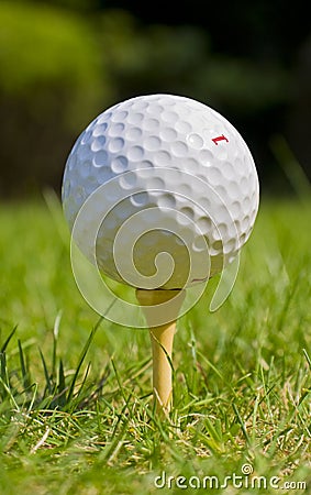 Golf ball on tee at golf course