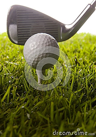 Golf club with ball on a tee