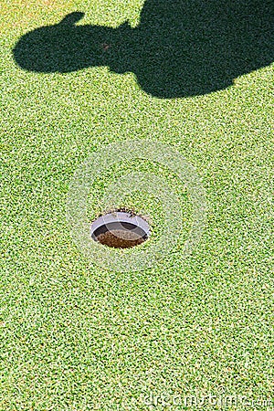 Golf hole and shadow