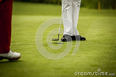 Golf player at hole