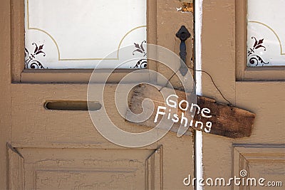 Gone Fishing Sign on old Country Store front door