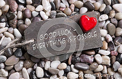 Good luck and everything is possible: greeting card with red hea