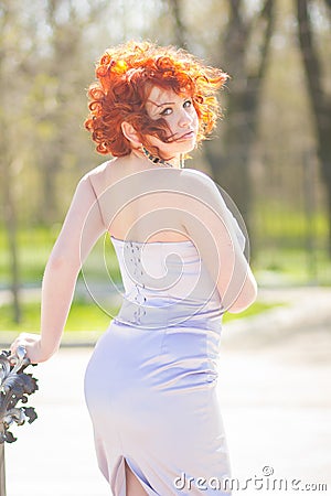 Gorgeous red-haired woman on a walk