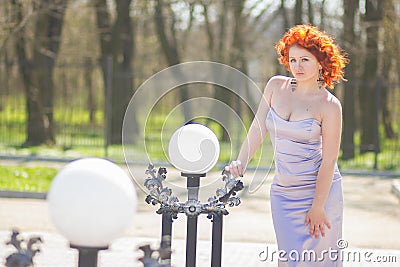 Gorgeous red-haired woman on a walk