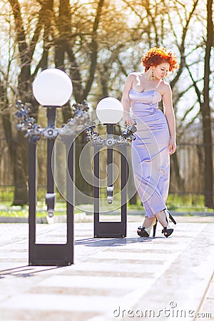 Gorgeous red-haired woman on a walk