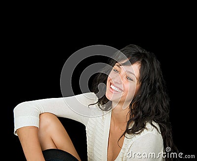 Gorgeous smiling woman on a black background.