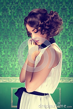 Gorgeous woman vintage toned image in retro room