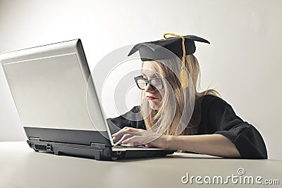 Graduated woman at the laptop