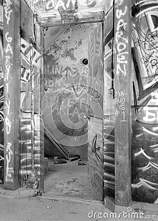 Graffiti covering a basement wall