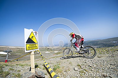 GRANADA, SPAIN - JUNE 30: Unknown racer on the competition of the mountain downhill bike Bull bikes Cup DH 2013, Sierra Nevada