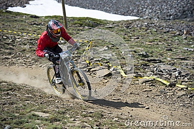 GRANADA, SPAIN - JUNE 30: Unknown racer on the competition of the mountain downhill bike Bull bikes Cup DH 2013, Sierra Nevada