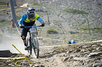 GRANADA, SPAIN - JUNE 30: Unknown racer on the competition of the mountain downhill bike Bull bikes Cup DH 2013, Sierra Nevada