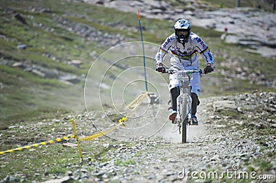 GRANADA, SPAIN - JUNE 30: Unknown racer on the competition of the mountain downhill bike Bull bikes Cup DH 2013, Sierra Nevada