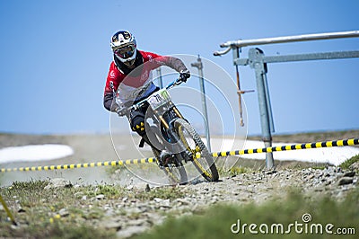 GRANADA, SPAIN - JUNE 30: Unknown racer on the competition of the mountain downhill bike Bull bikes Cup DH 2013, Sierra Nevada