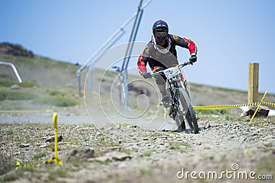 GRANADA, SPAIN - JUNE 30: Unknown racer on the competition of the mountain downhill bike Bull bikes Cup DH 2013, Sierra Nevada