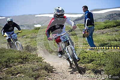 GRANADA, SPAIN - JUNE 30: Unknown racer on the competition of the mountain downhill bike Bull bikes Cup DH 2013, Sierra Nevada