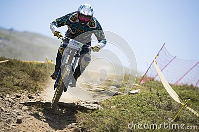 GRANADA, SPAIN - JUNE 30: Unknown racer on the competition of the mountain downhill bike Bull bikes Cup DH 2013, Sierra Nevada