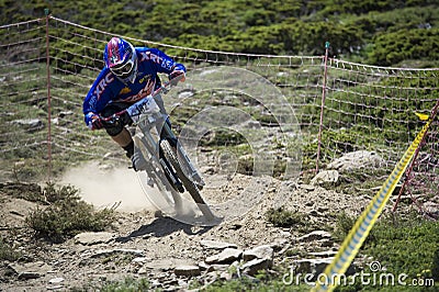 GRANADA, SPAIN - JUNE 30: Unknown racer on the competition of the mountain downhill bike Bull bikes Cup DH 2013, Sierra Nevada