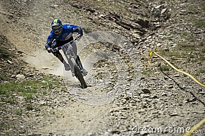 GRANADA, SPAIN - JUNE 30: Unknown racer on the competition of the mountain downhill bike Bull bikes Cup DH 2013, Sierra Nevada