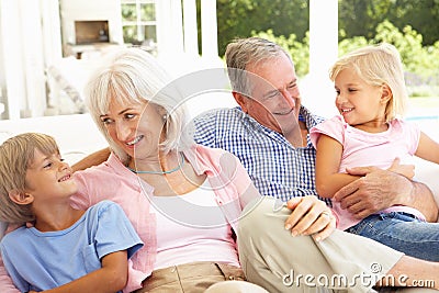 Grandparents With Grandchildren Relaxing Together