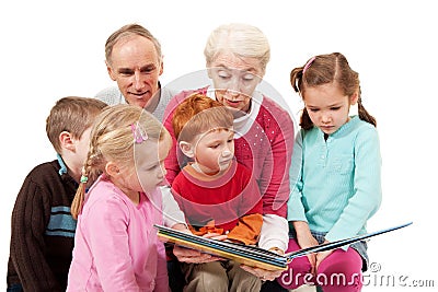 Grandparents reading kids story book to children