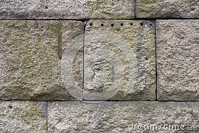 Granite Stone Block Wall, weathered with quarry marks