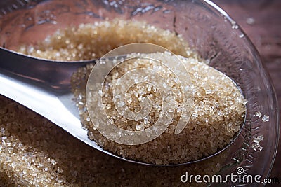 Granulated sugar in spoon.