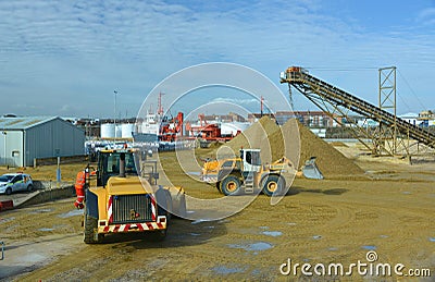 Gravel being moved by heavy vehicles