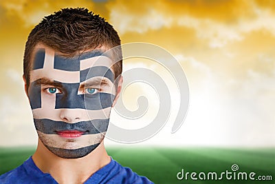 Greek football fan in face paint