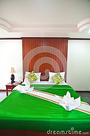 Green bedroom ready for guests