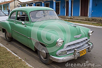 Green car parked on street in Vinales, Cuba