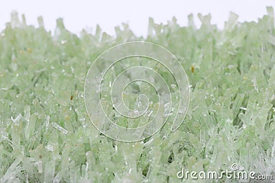 Green crystals on light background